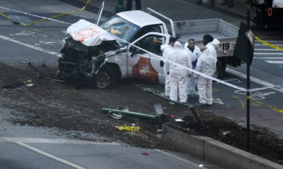 Investigators inspect a truck following a shooting incident in New York on October 31, 2017. 
Several people were killed and numerous others injured in New York on Tuesday after a vehicle plowed into a pedestrian and bike path in Lower Manhattan, police said. "The vehicle struck multiple people on the path," police tweeted. "The vehicle continued south striking another vehicle. The suspect exited the vehicle displaying imitation firearms & was shot by NYPD." / AFP PHOTO / DON EMMERT        (Photo credit should read DON EMMERT/AFP/Getty Images)