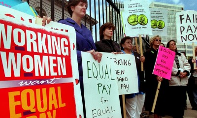 DayNews - Equal Pay Day 2000 ' Rally in front of the U.S Mint, 300 W. Colfax Ave. , Several womens groups speak out about the current wage gap for women and people of colora . smone where carrying red purses to show that women's pay is still in the red, compared